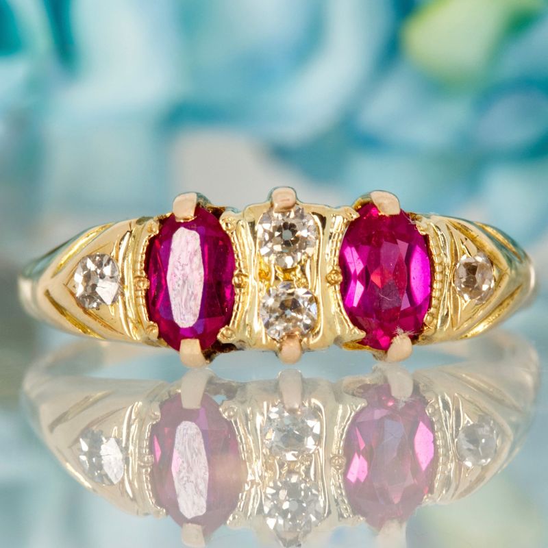 Pre-Loved 18ct Yellow Gold Oval Cut Ruby & Round Brilliant Cut Diamond Dress Ring