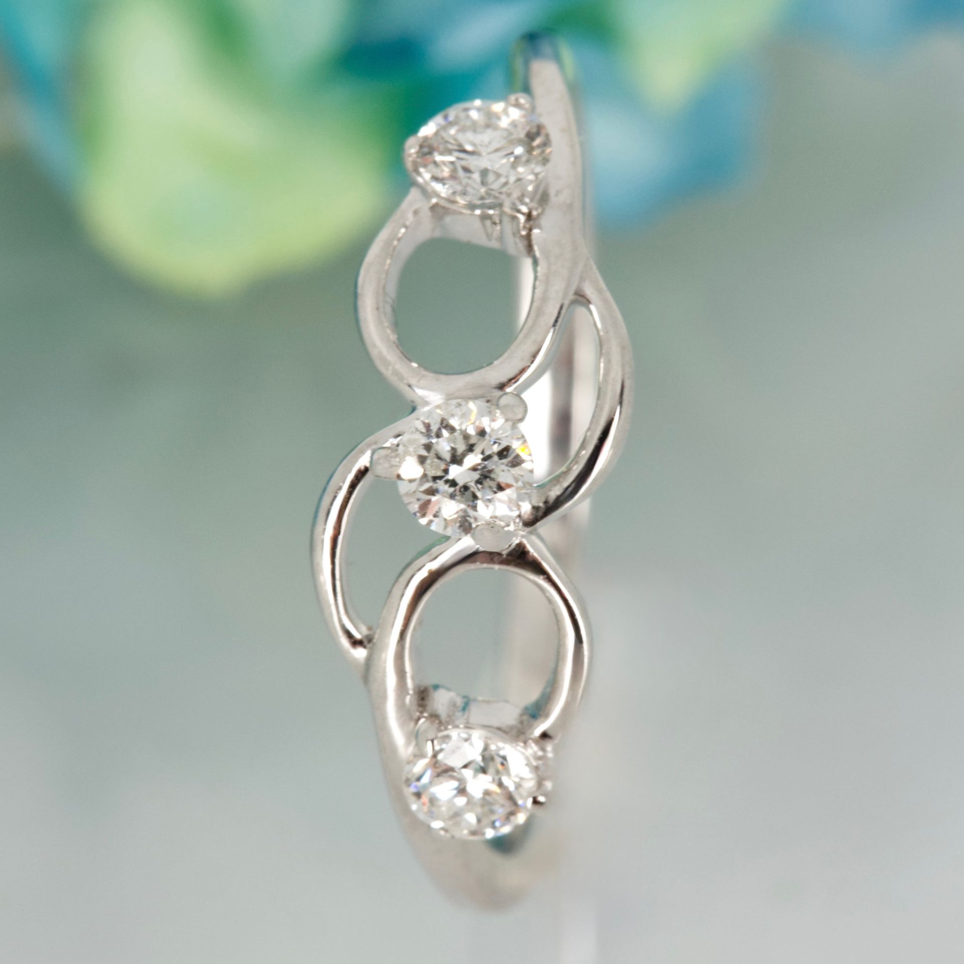 Pre-Loved 9ct White Gold Round Brilliant Cut Diamond Trilogy Swirl Ring