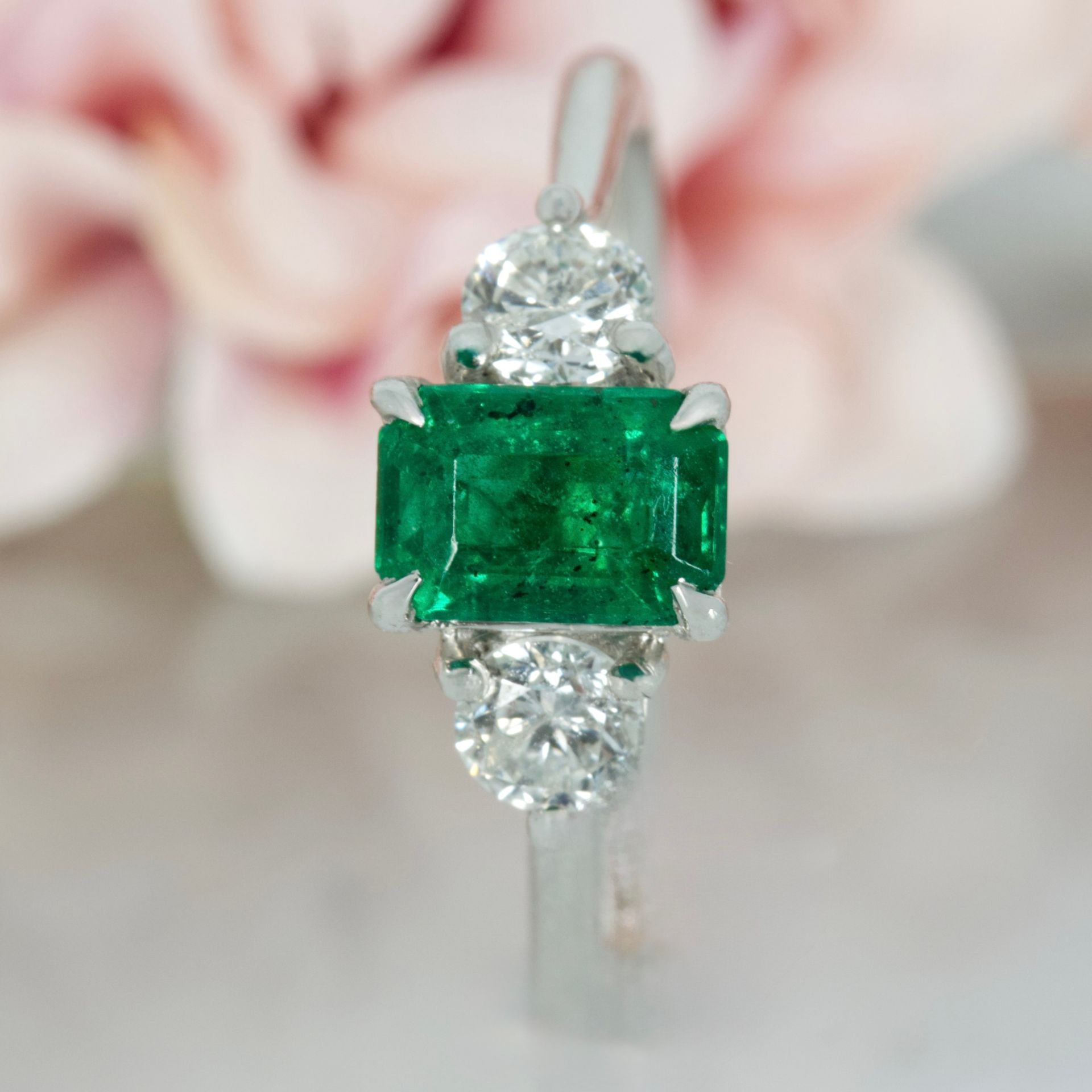 Platinum Octagonal Cut Emerald & Round Brilliant Cut Diamond Trilogy Ring