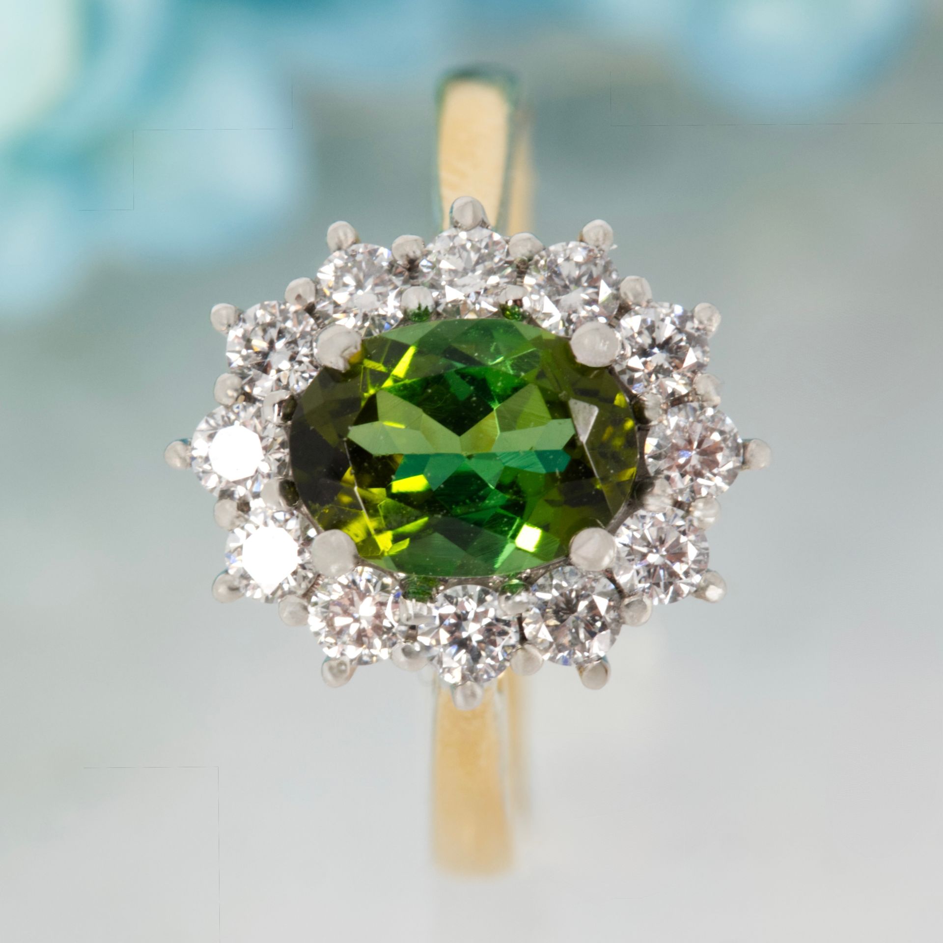 18ct Yellow Gold & Platinum Oval Cut Green Tourmaline & Round Brilliant Cut Diamond Cluster Ring
