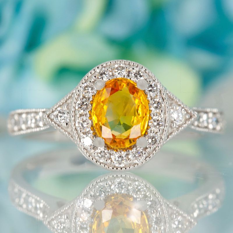 Platinum Oval Cut Yellow Sapphire & Round Brilliant Cut Diamond Halo Cluster Ring