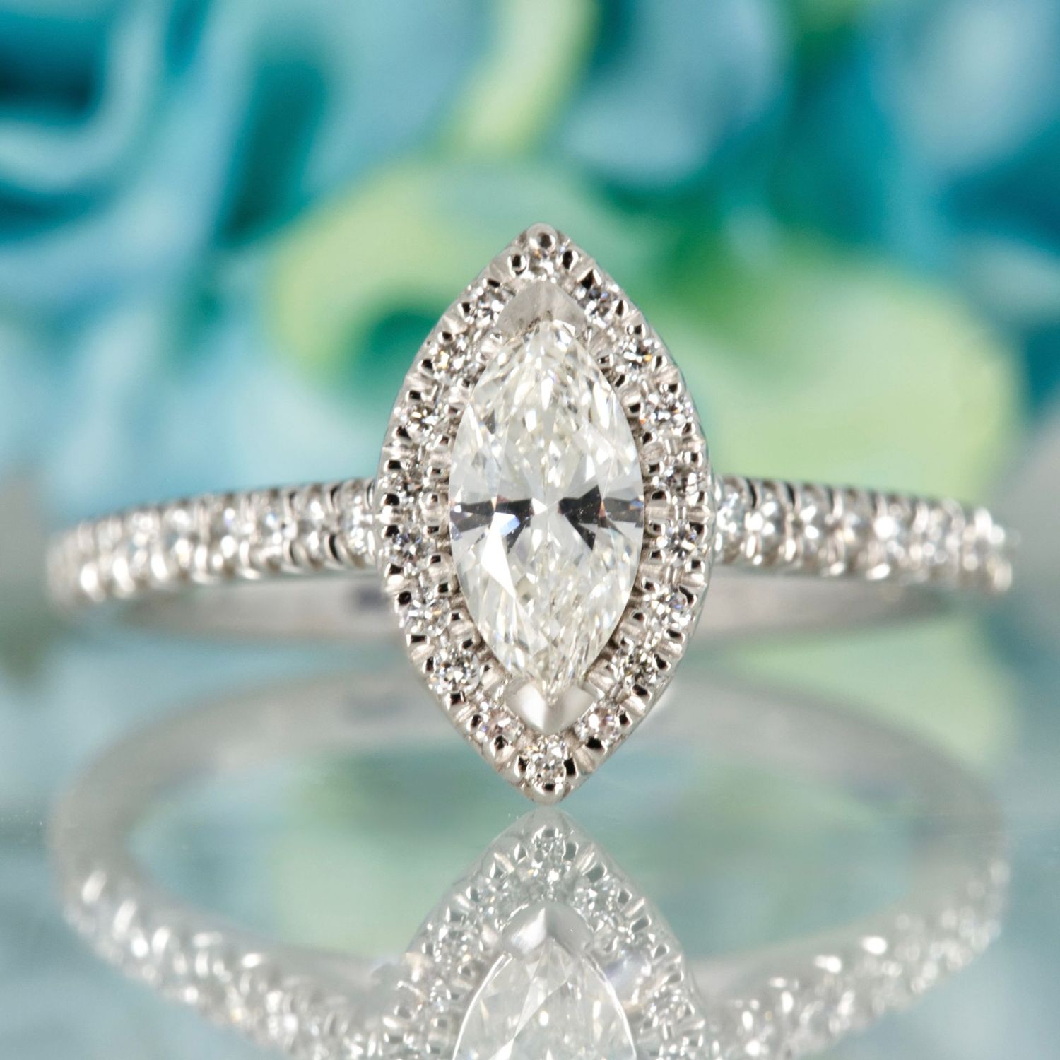 Platinum GIA Certified Marquise Cut Diamond & Round Brilliant Cut Diamond Halo Cluster Ring Platinum GIA Certified Marquise Cut Diamond & Round Brilliant Cut Diamond Halo Cluster Ring