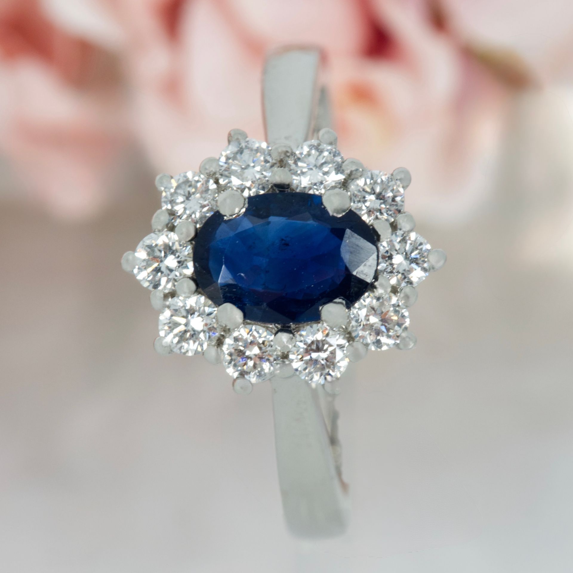 Platinum Oval Cut Sapphire & Round Brilliant Cut Diamond Cluster Ring
