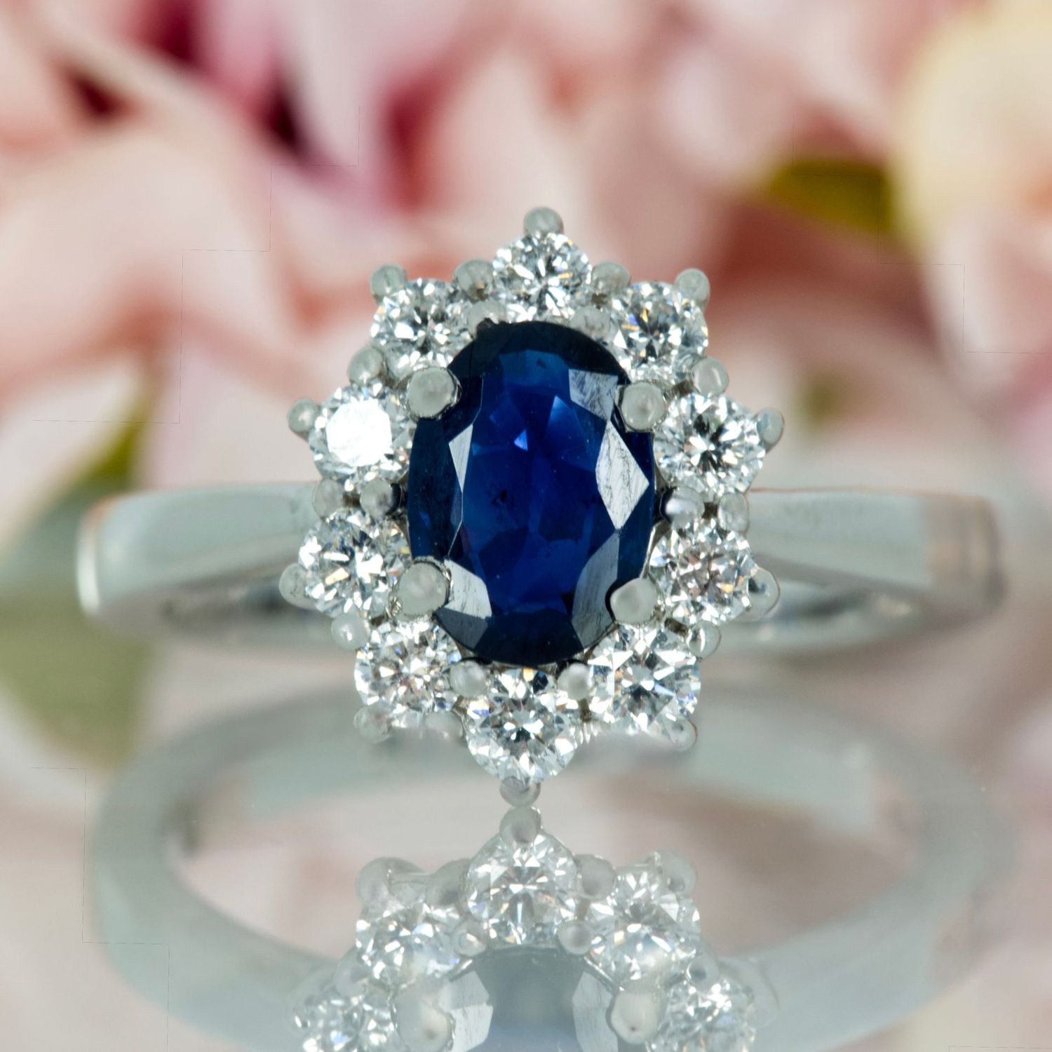 Platinum Oval Cut Sapphire & Round Brilliant Cut Diamond Cluster Ring