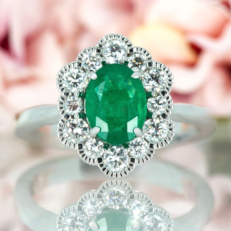 Platinum Oval Cut Emerald & Round Brilliant Cut Diamond Cluster Ring