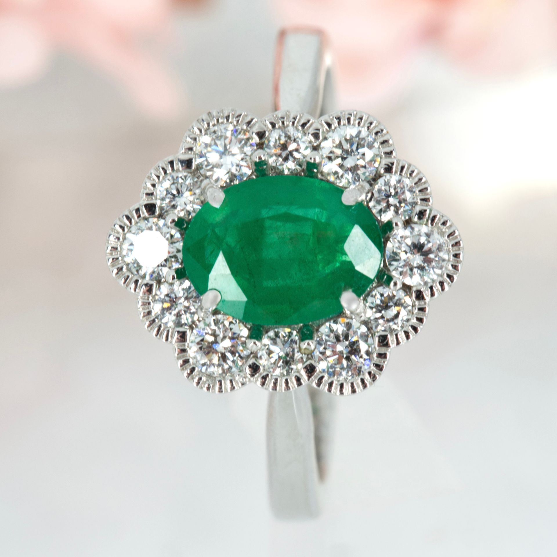 Platinum Oval Cut Emerald & Round Brilliant Cut Diamond Cluster Ring