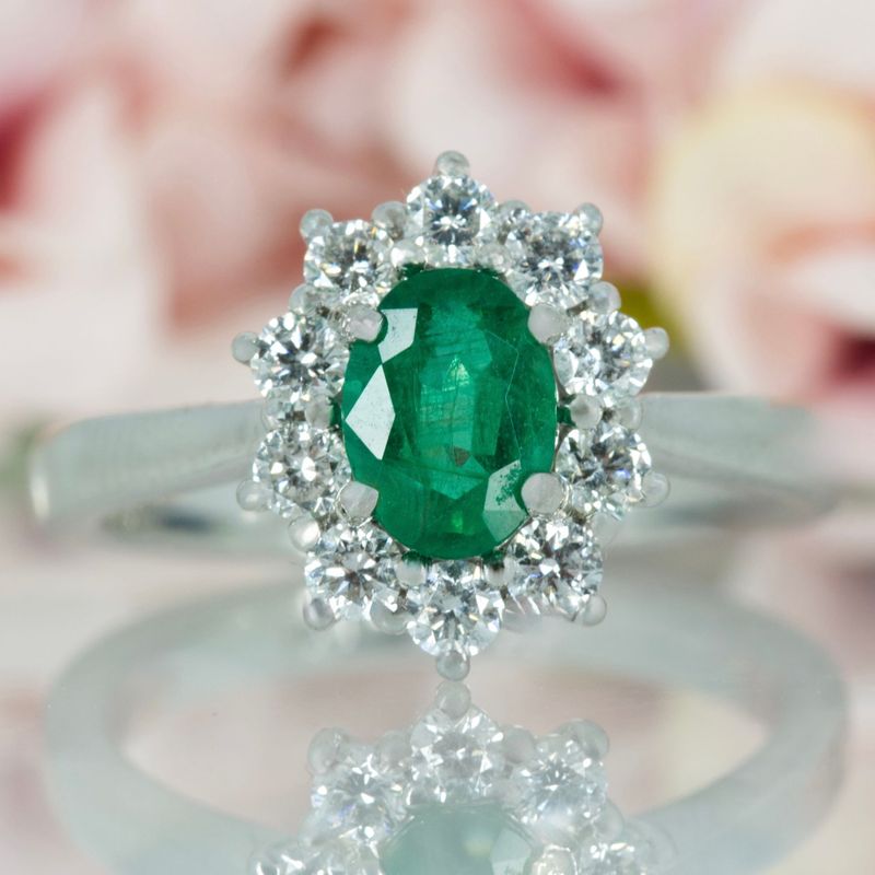 Platinum Oval Cut Emerald & Round Brilliant Cut Diamond Cluster Ring