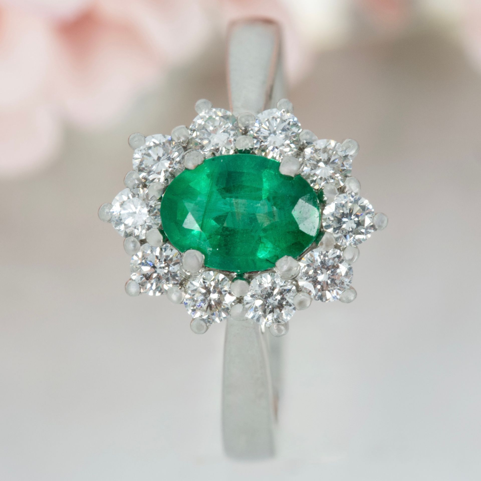 Platinum Oval Cut Emerald & Round Brilliant Cut Diamond Cluster Ring