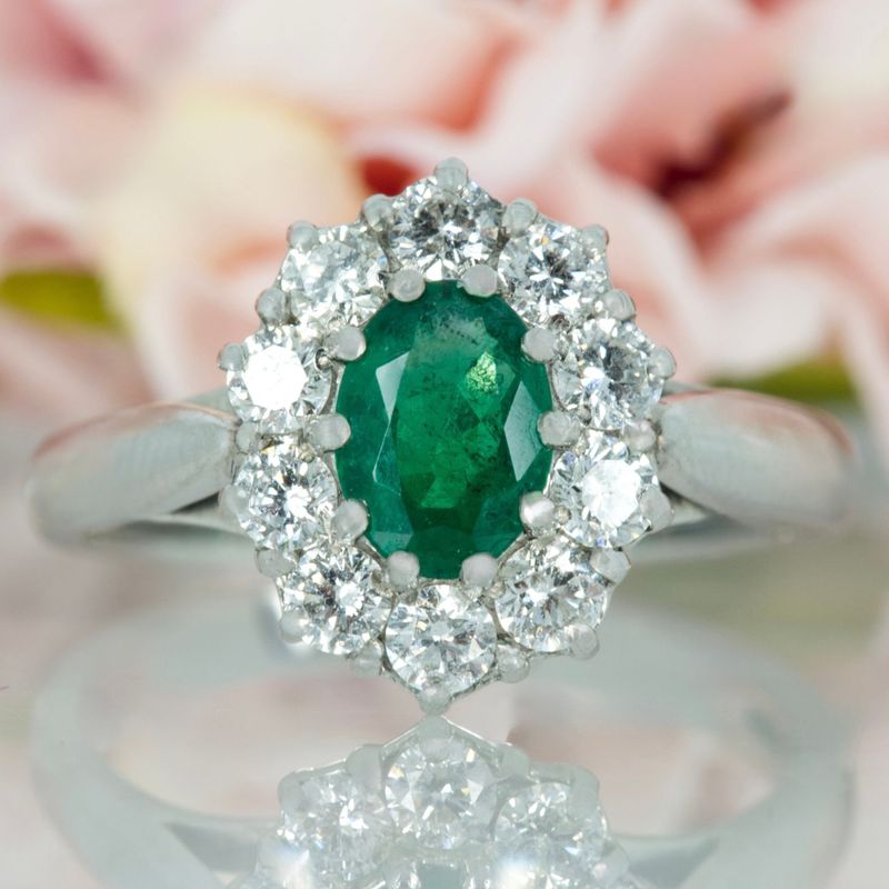Platinum Oval Cut Emerald & Round Brilliant Cut Diamond Cluster Ring