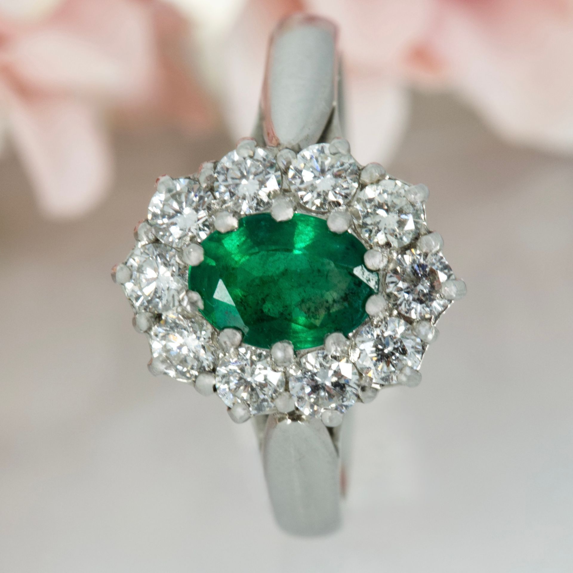 Platinum Oval Cut Emerald & Round Brilliant Cut Diamond Cluster Ring