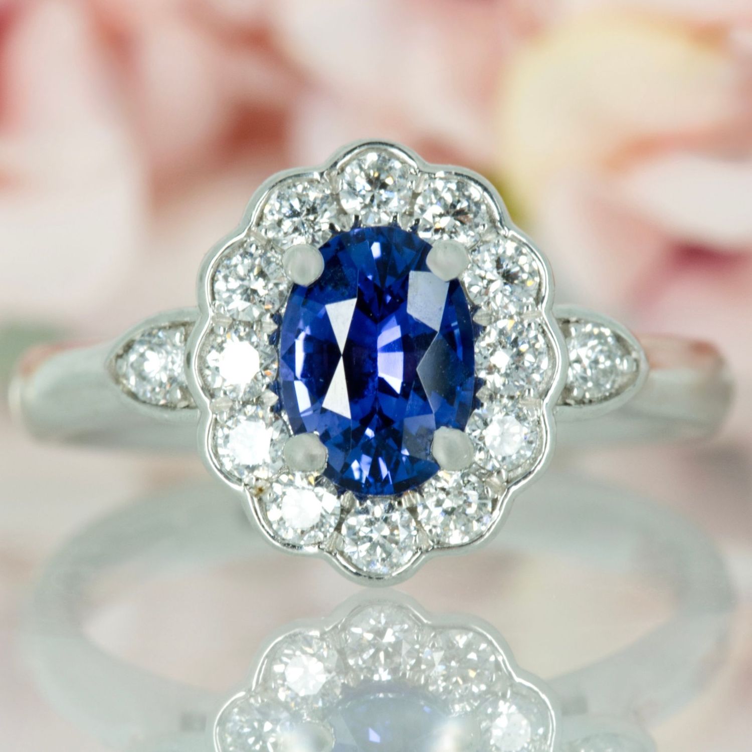Platinum Oval Cut Sapphire & Round Brilliant Cut Diamond Cluster Ring