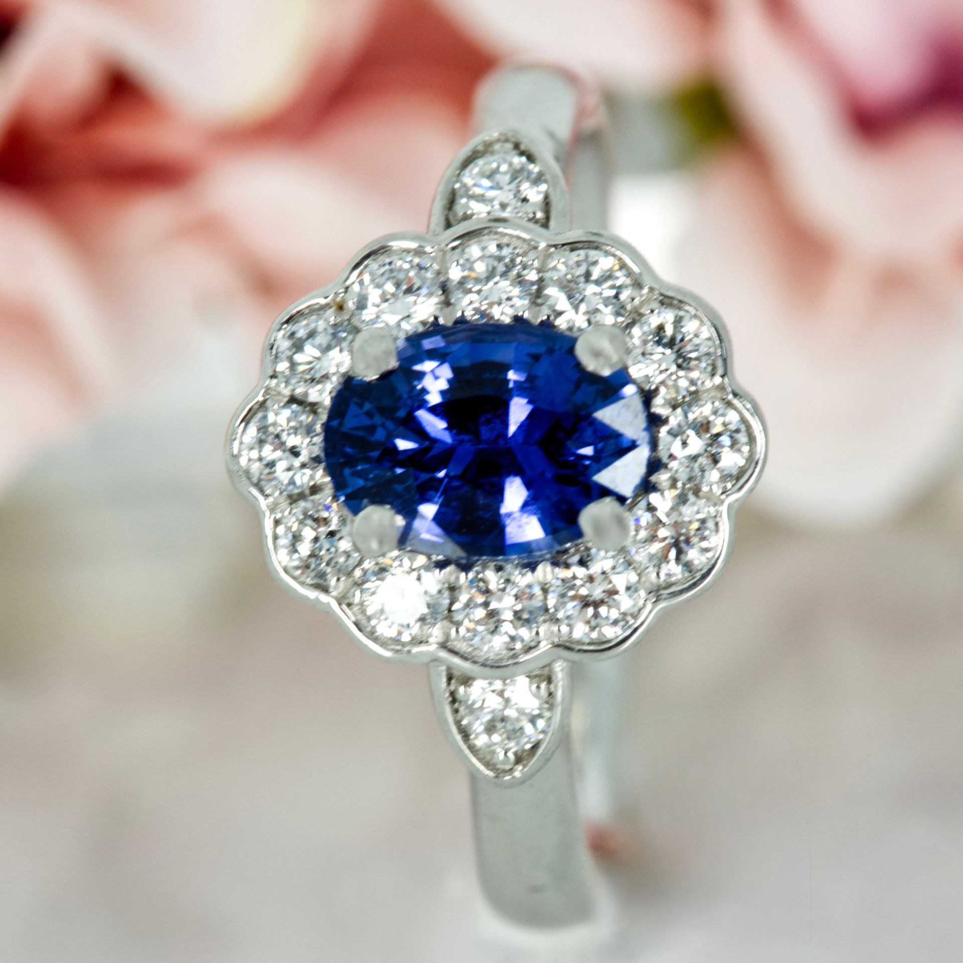 Platinum Oval Cut Sapphire & Round Brilliant Cut Diamond Cluster Ring