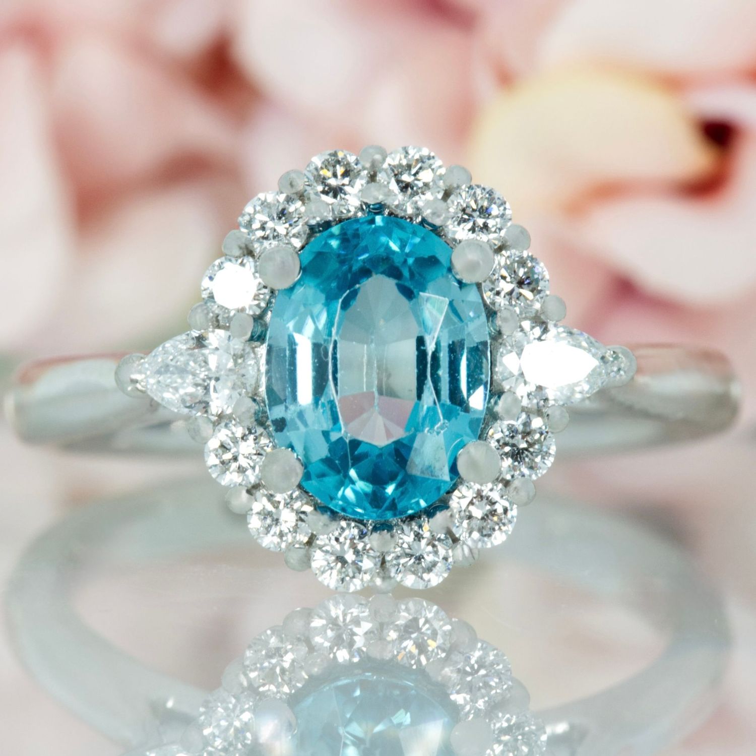 Platinum Oval Cut Blue Zircon & Pear and Round Brilliant Cut Diamond Cluster Ring