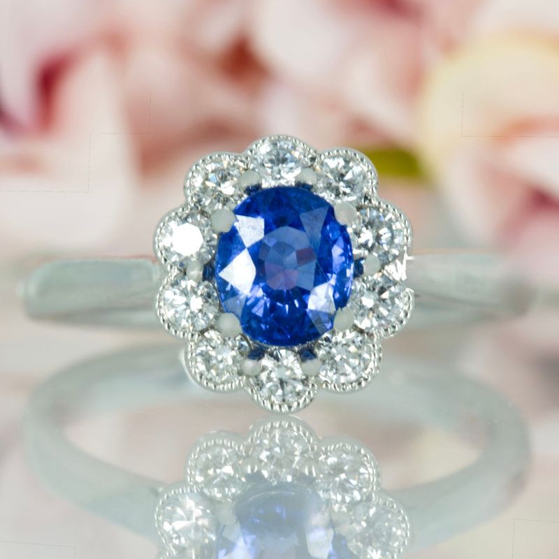 Platinum Oval Cut Sapphire & Round Brilliant Cut Diamond Cluster Ring