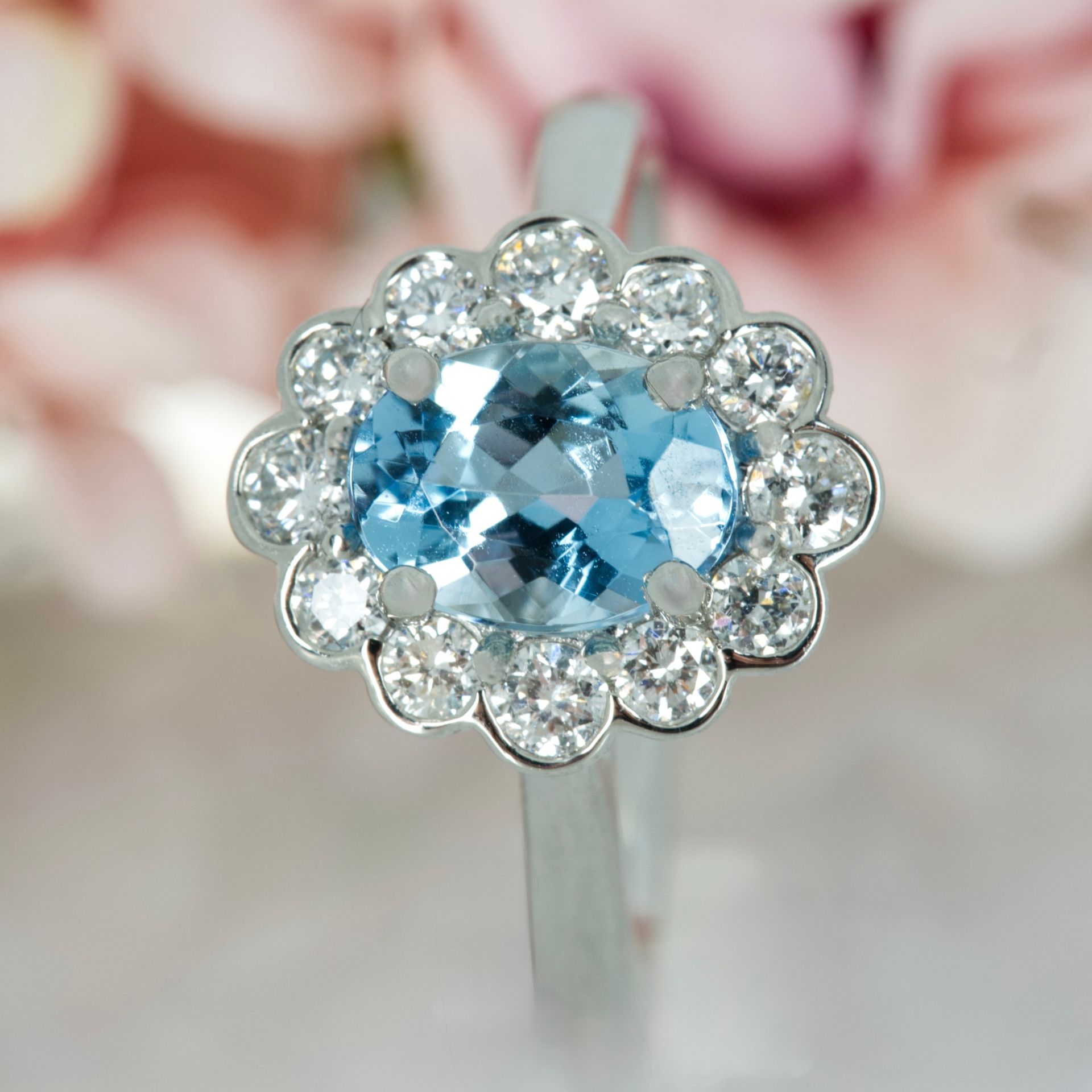 Platinum Oval Cut Aquamarine & Round Brilliant Cut Diamond Cluster Ring