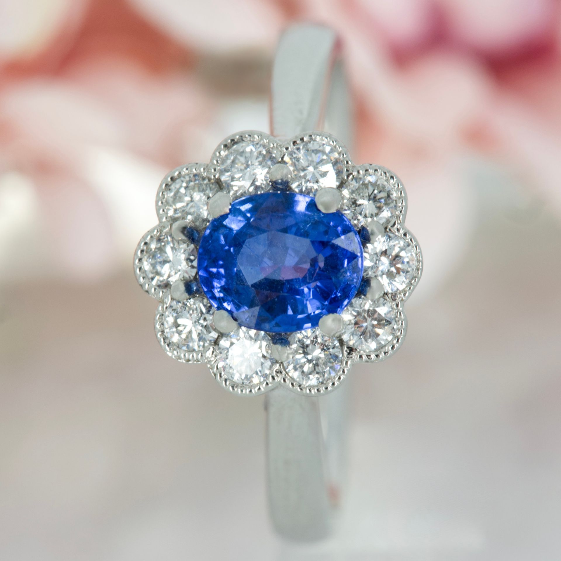 Platinum Oval Cut Sapphire & Round Brilliant Cut Diamond Cluster Ring