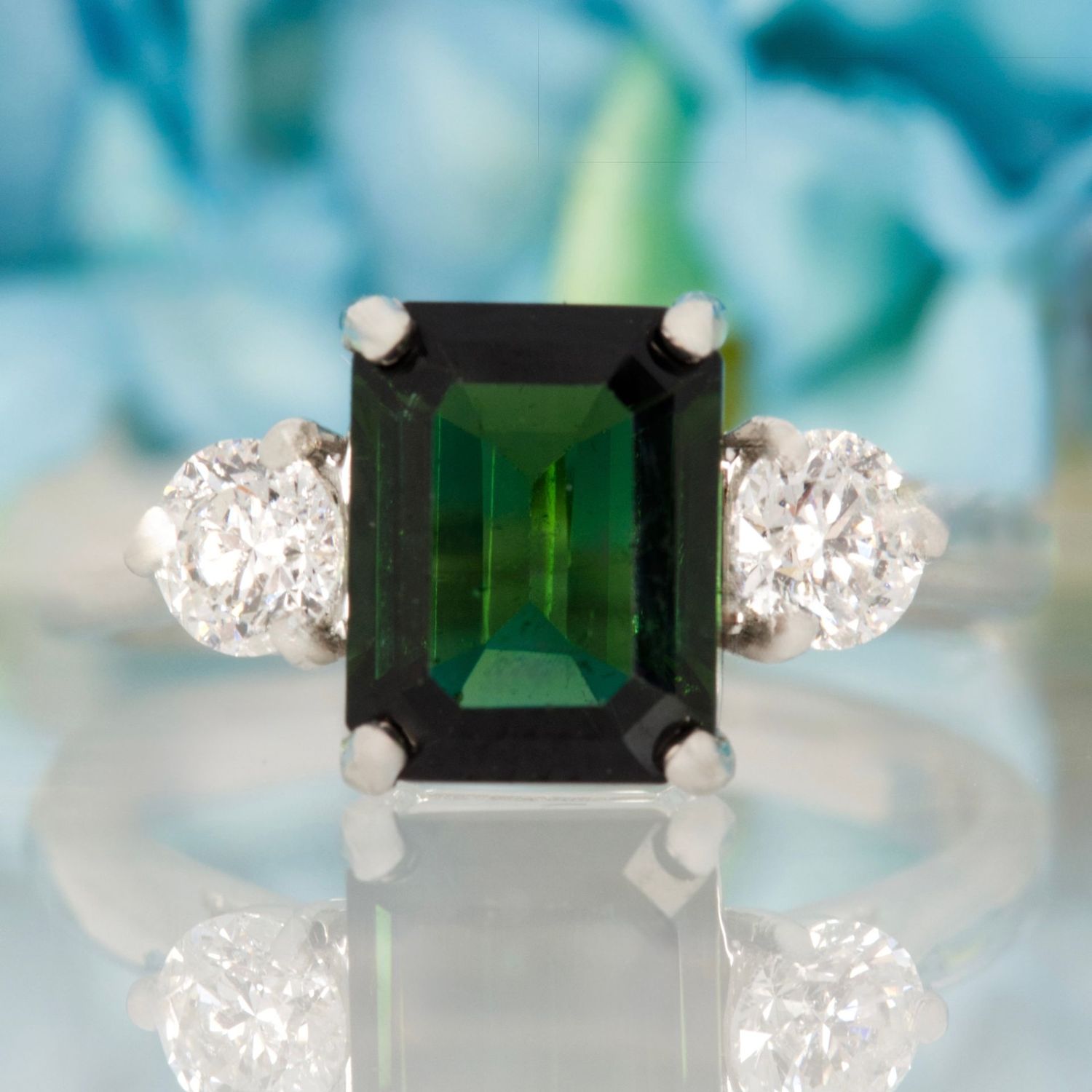 Platinum Octagonal Cut Green Tourmaline & Round Brilliant Cut Diamond Trilogy Ring Platinum Octagonal Cut Green Tourmaline & Round Brilliant Cut Diamond Trilogy Ring