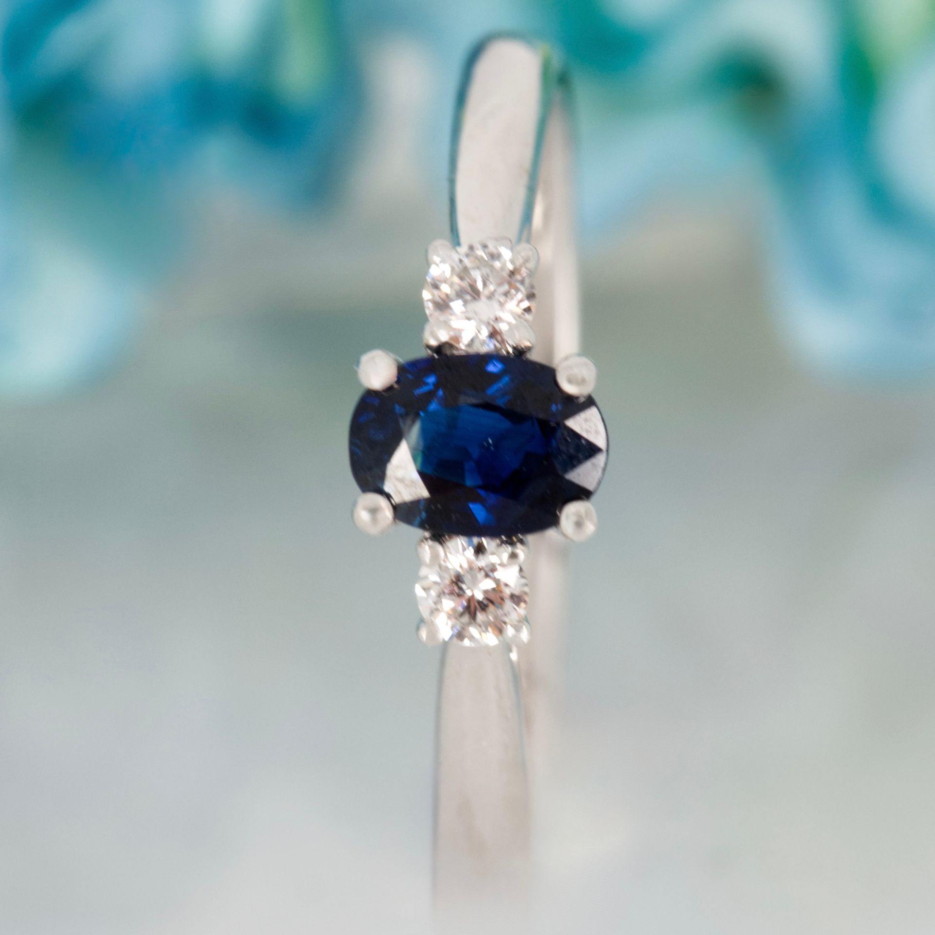 Platinum Oval Cut Sapphire & Round Brilliant Cut Diamond Trilogy Ring