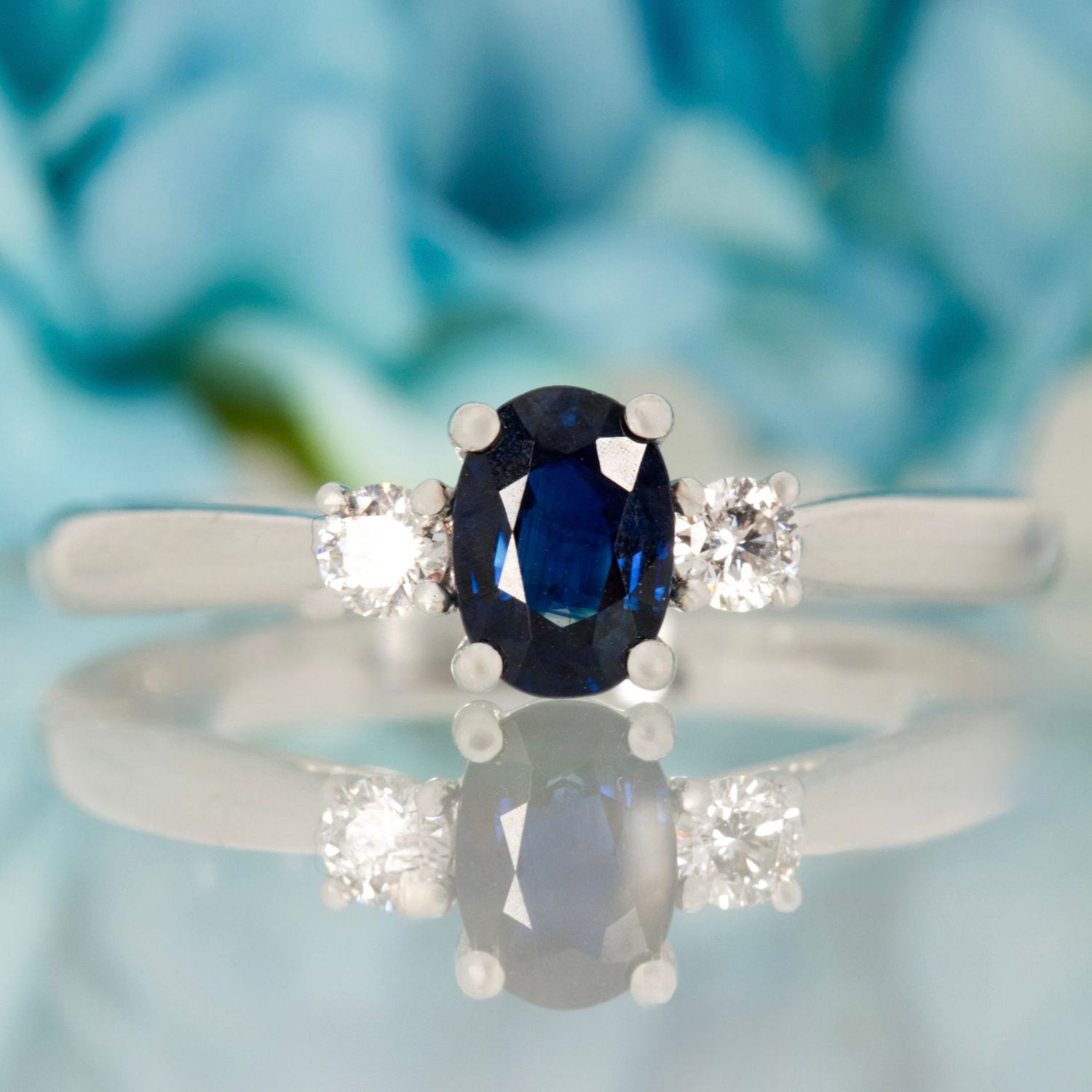Platinum Oval Cut Sapphire & Round Brilliant Cut Diamond Trilogy Ring Platinum Oval Cut Sapphire & Round Brilliant Cut Diamond Trilogy Ring