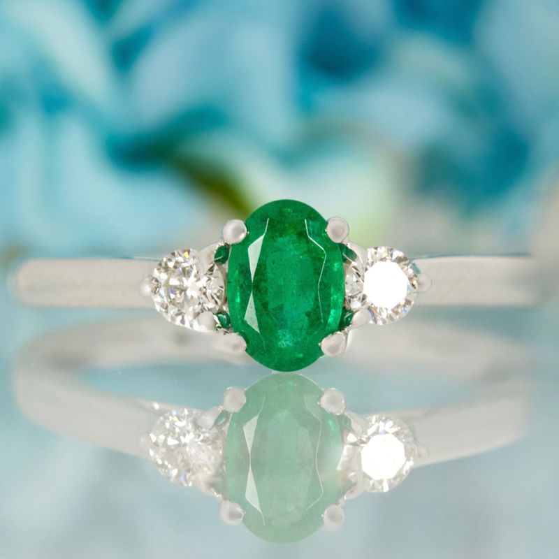 Platinum Oval Cut Emerald & Round Brilliant Cut Diamond Trilogy Ring