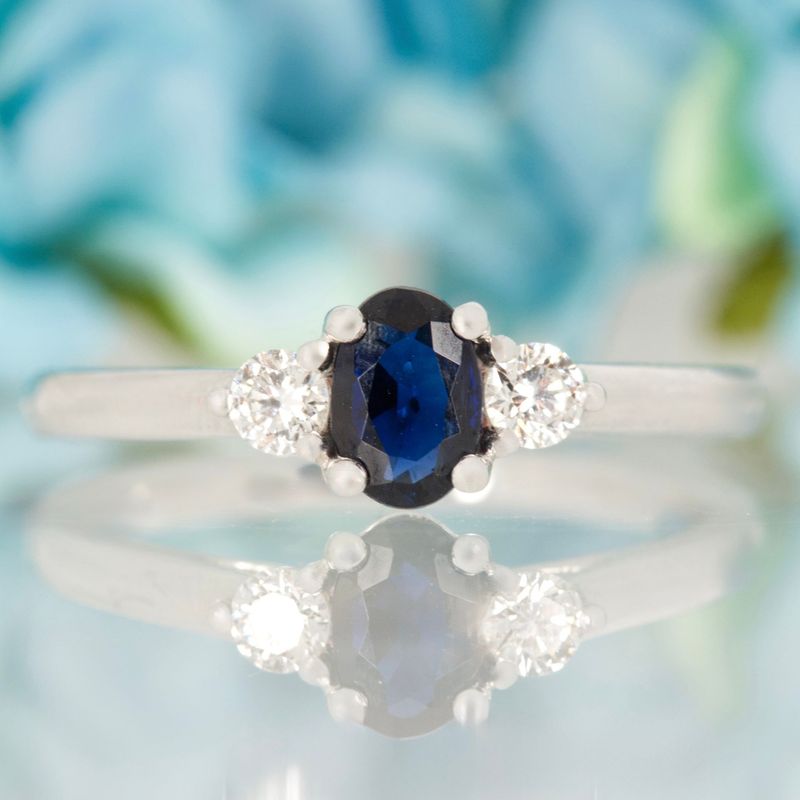 Platinum Oval Cut Sapphire & Round Brilliant Cut Diamond Trilogy Ring