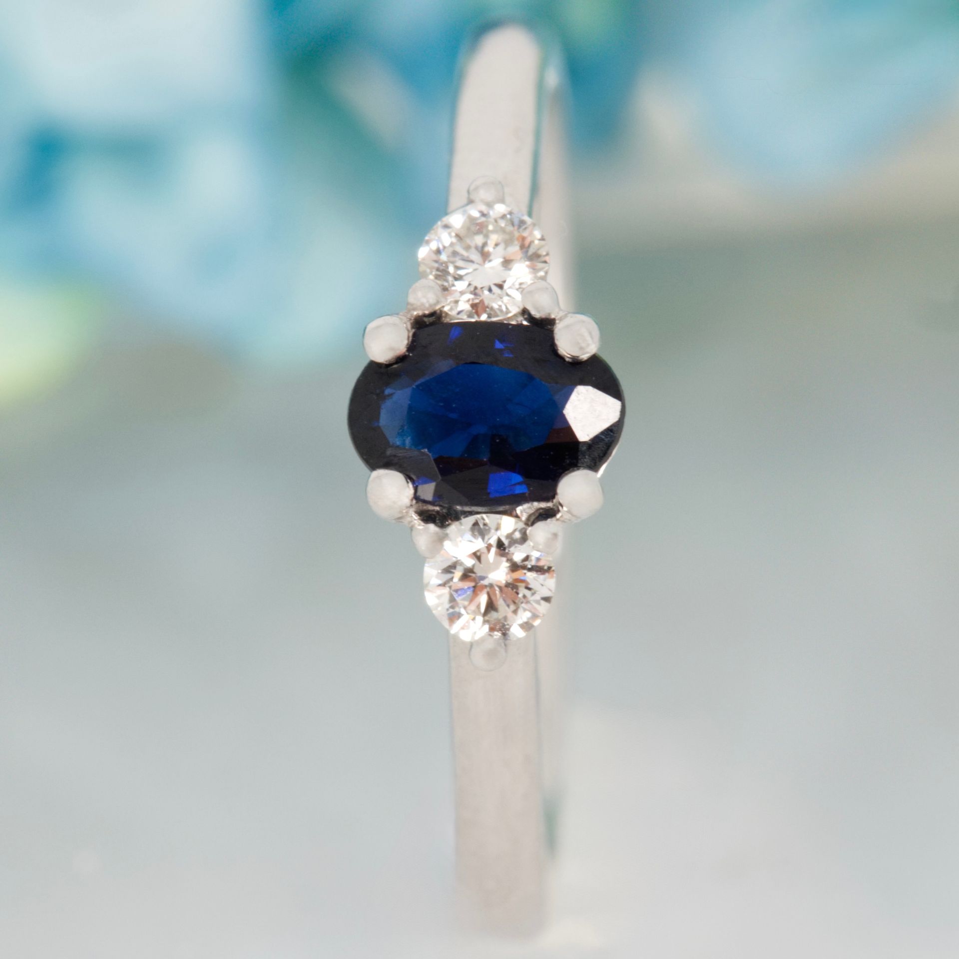 Platinum Oval Cut Sapphire & Round Brilliant Cut Diamond Trilogy Ring