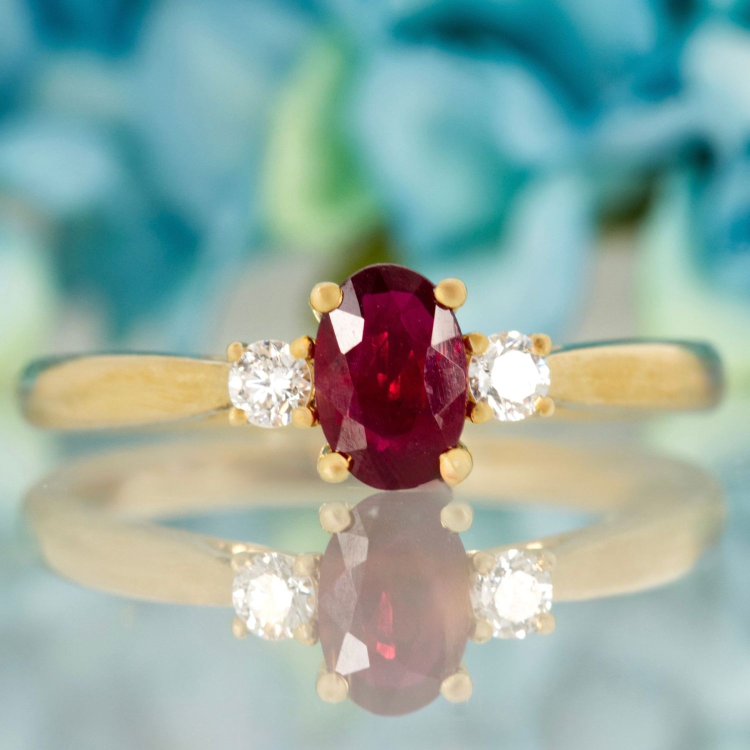 18ct Yellow Gold Oval Cut Ruby & Round Brilliant Cut Diamond Trilogy Ring