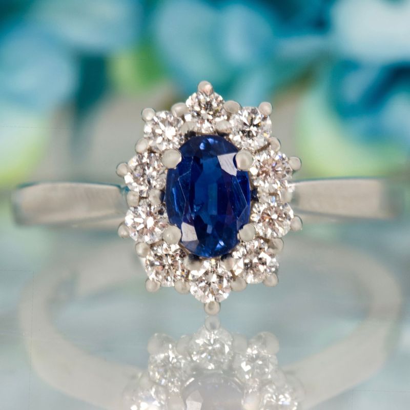 Platinum Oval Cut Sapphire & Round Brilliant Cut Diamond Cluster Ring