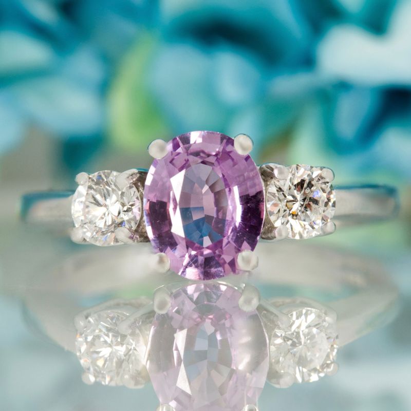 Pre-Loved 18ct White Gold Oval Cut Lilac Sapphire & Round Brilliant Cut Diamond Trilogy Ring