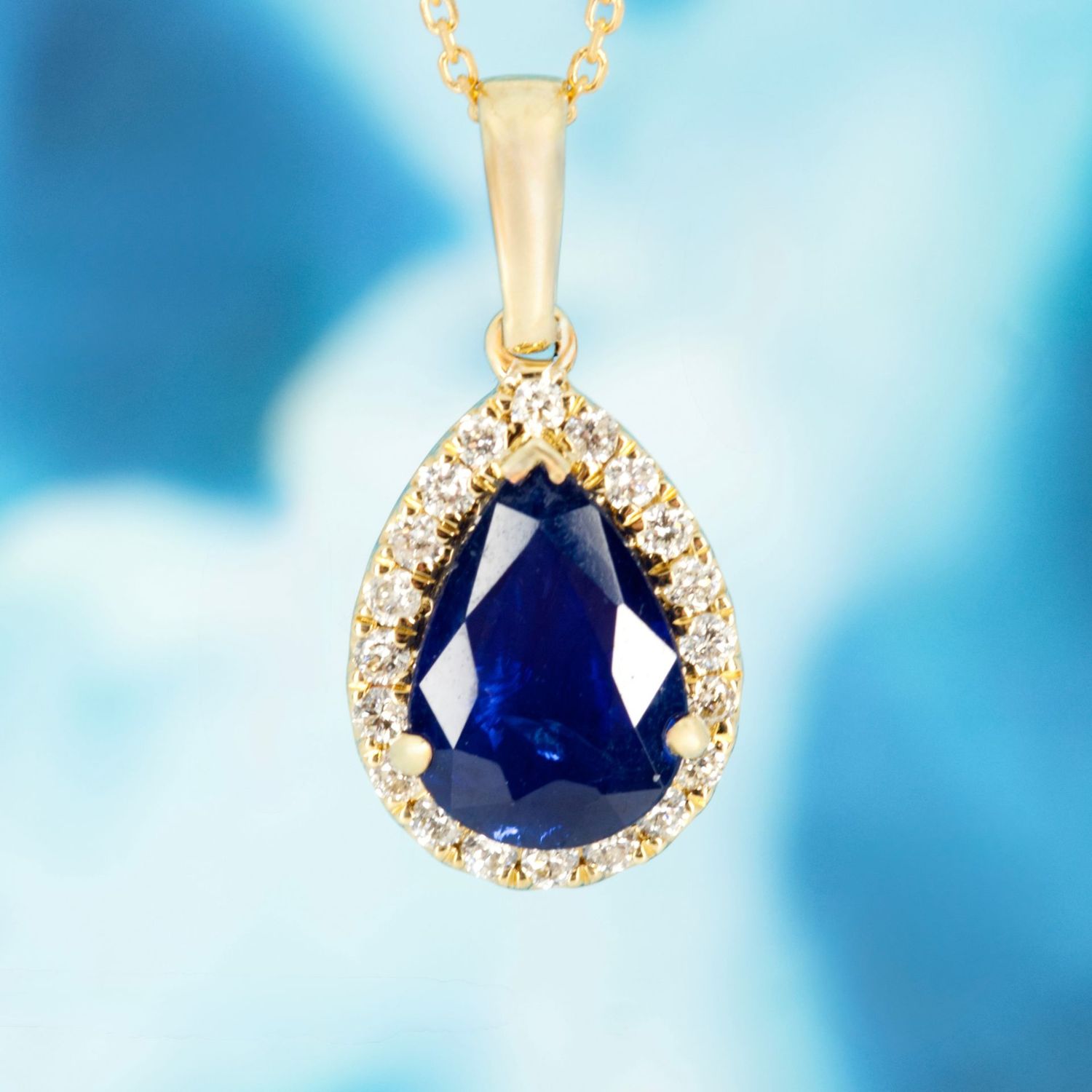 9ct Yellow Gold Pear Cut Sapphire & Round Brilliant Cut Diamond Halo Cluster Pendant & Chain
