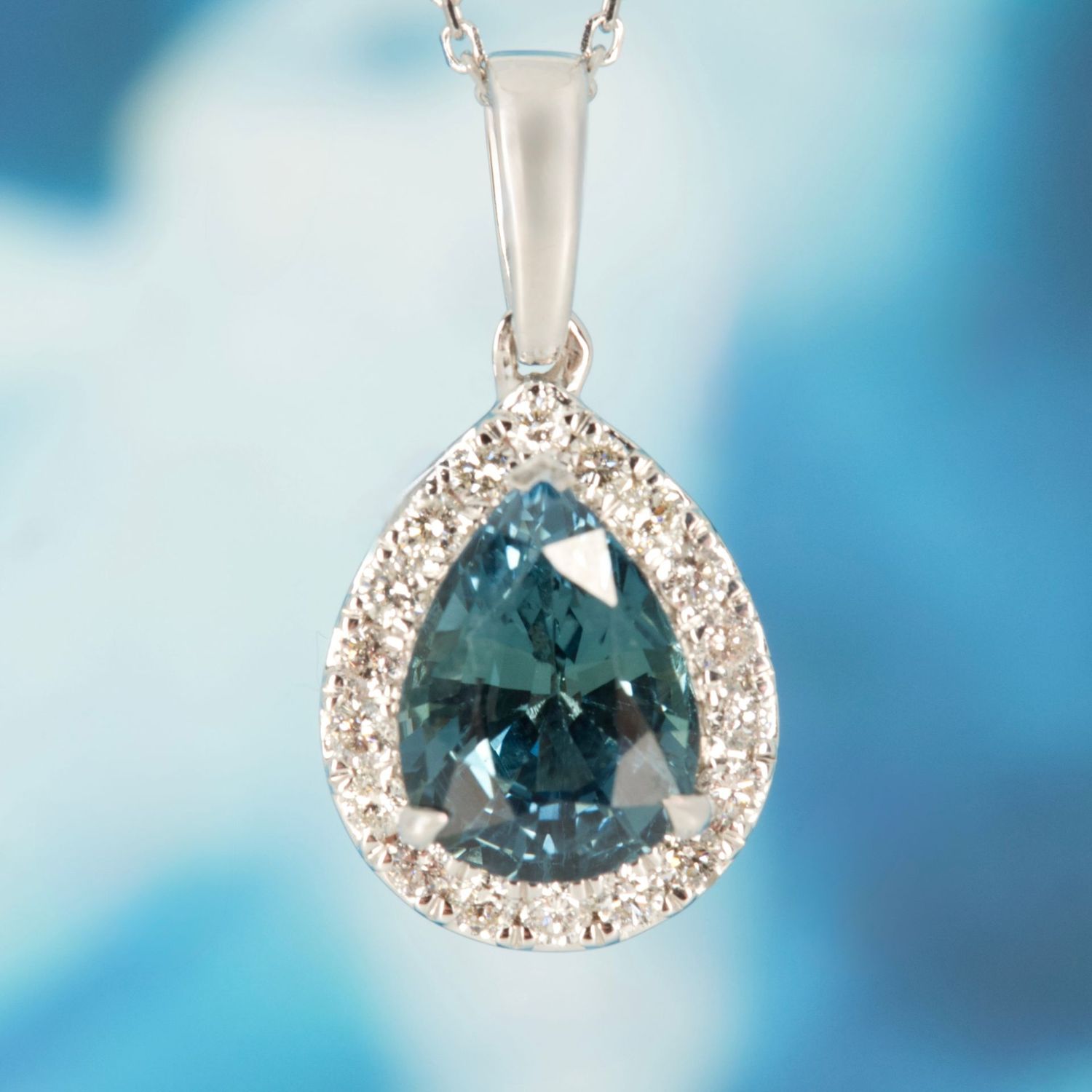 9ct White Gold Pear Cut Teal Sapphire & Round Brilliant Cut Diamond Halo Cluster Pendant & Chain