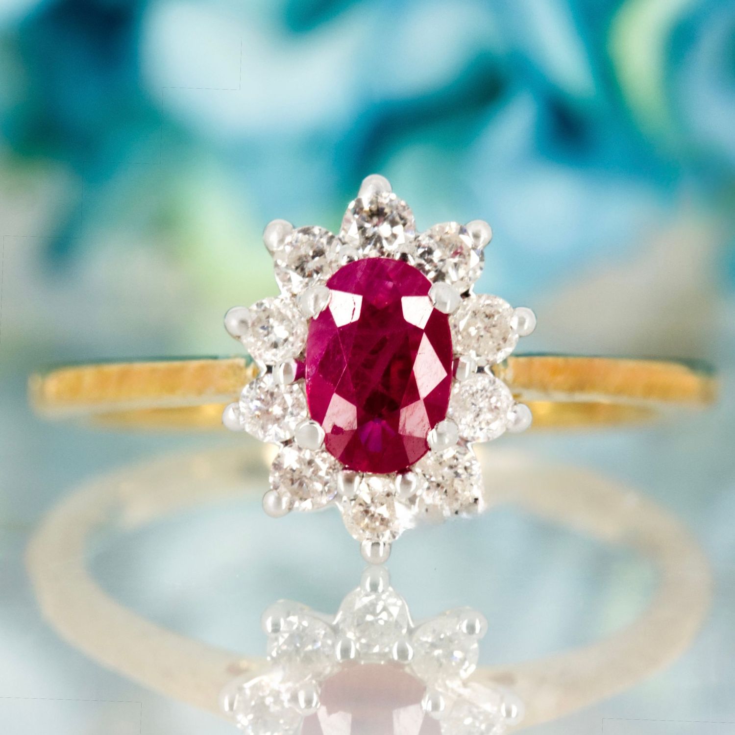 9ct Yellow Gold Oval Cut Ruby & Round Brilliant Cut Diamond Cluster Ring 9ct Yellow Gold Oval Cut Ruby & Round Brilliant Cut Diamond Cluster Ring