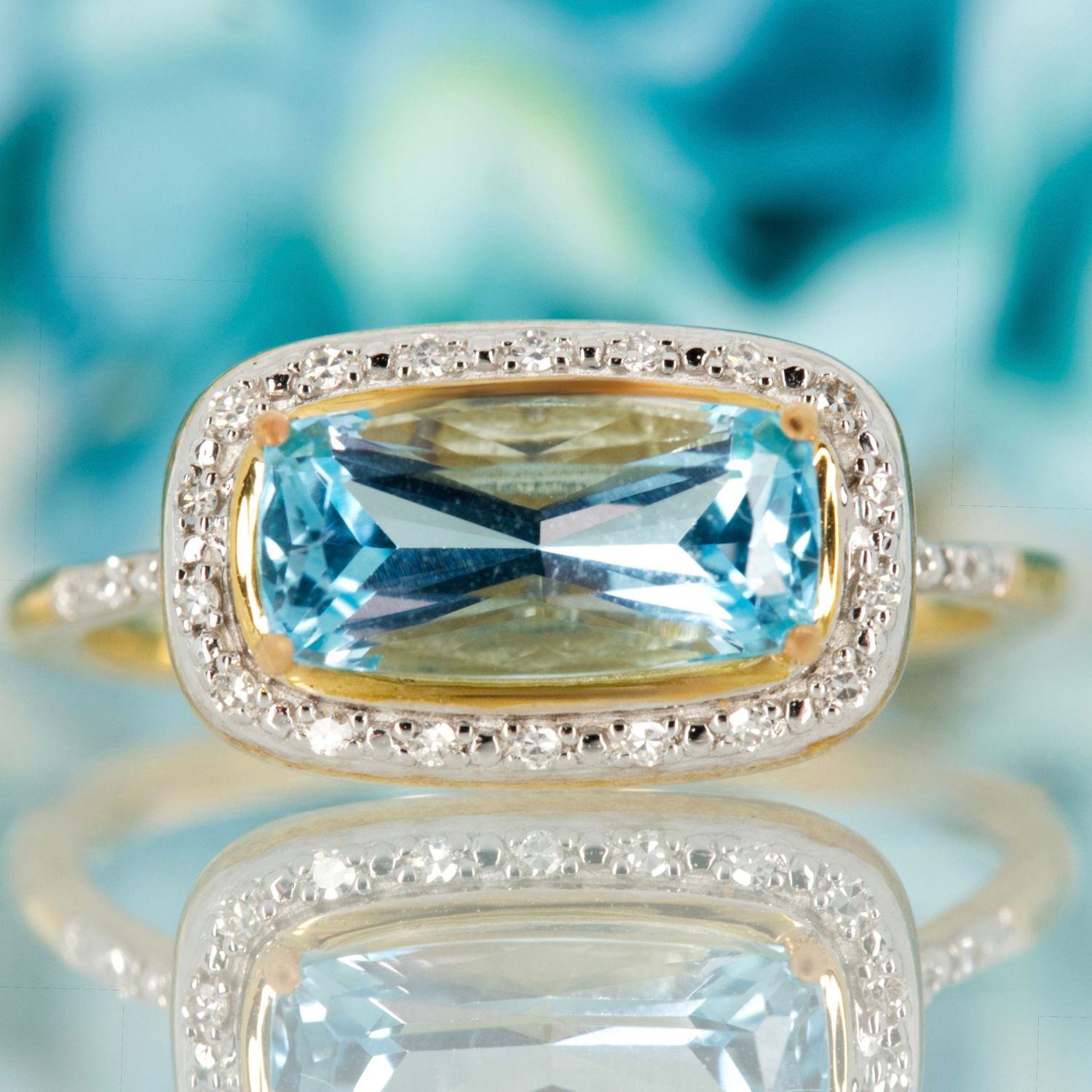 9ct Yellow Gold Rectangular Cut Blue Topaz & Round Brilliant Cut Diamond Halo Cluster Ring