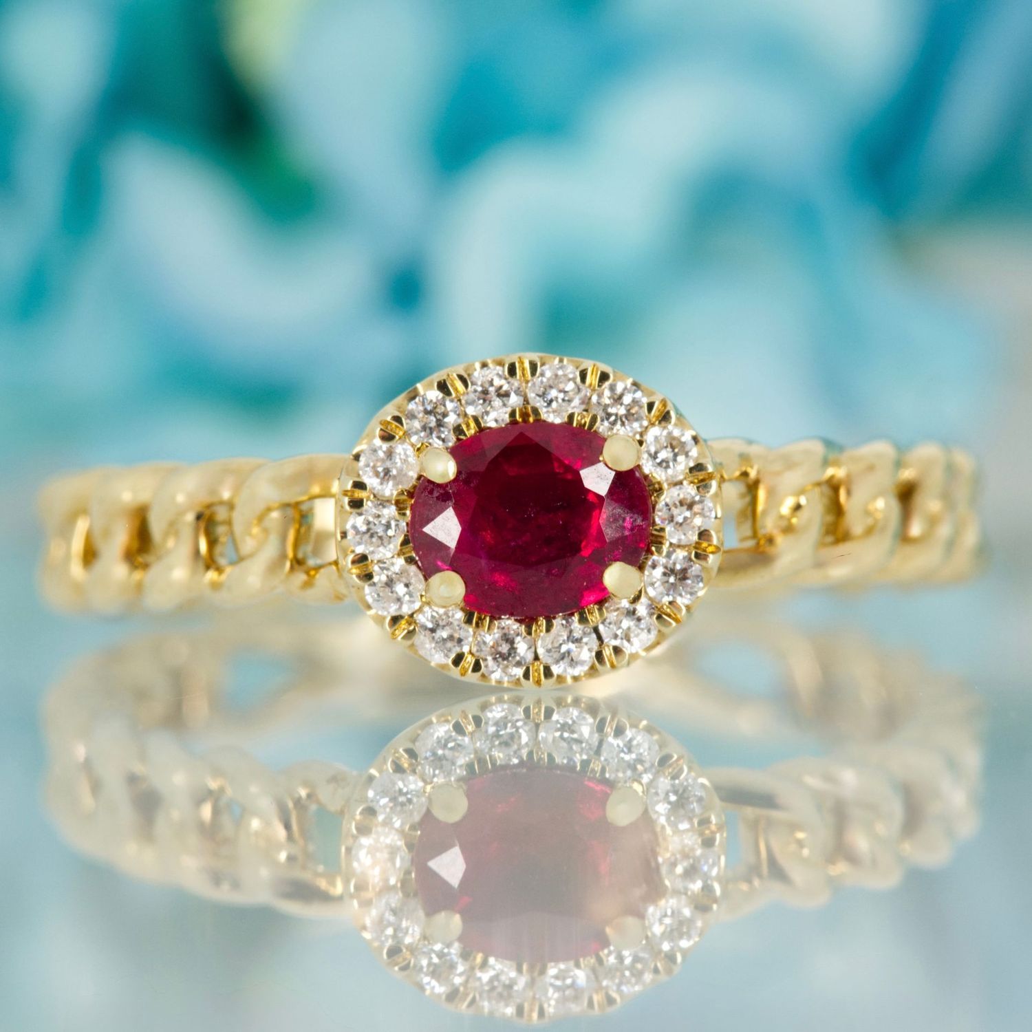 9ct Yellow Gold Oval Cut Ruby & Round Brilliant Cut Diamond Horizontal Halo Cluster Ring 9ct Yellow Gold Oval Cut Ruby & Round Brilliant Cut Diamond Horizontal Halo Cluster Ring