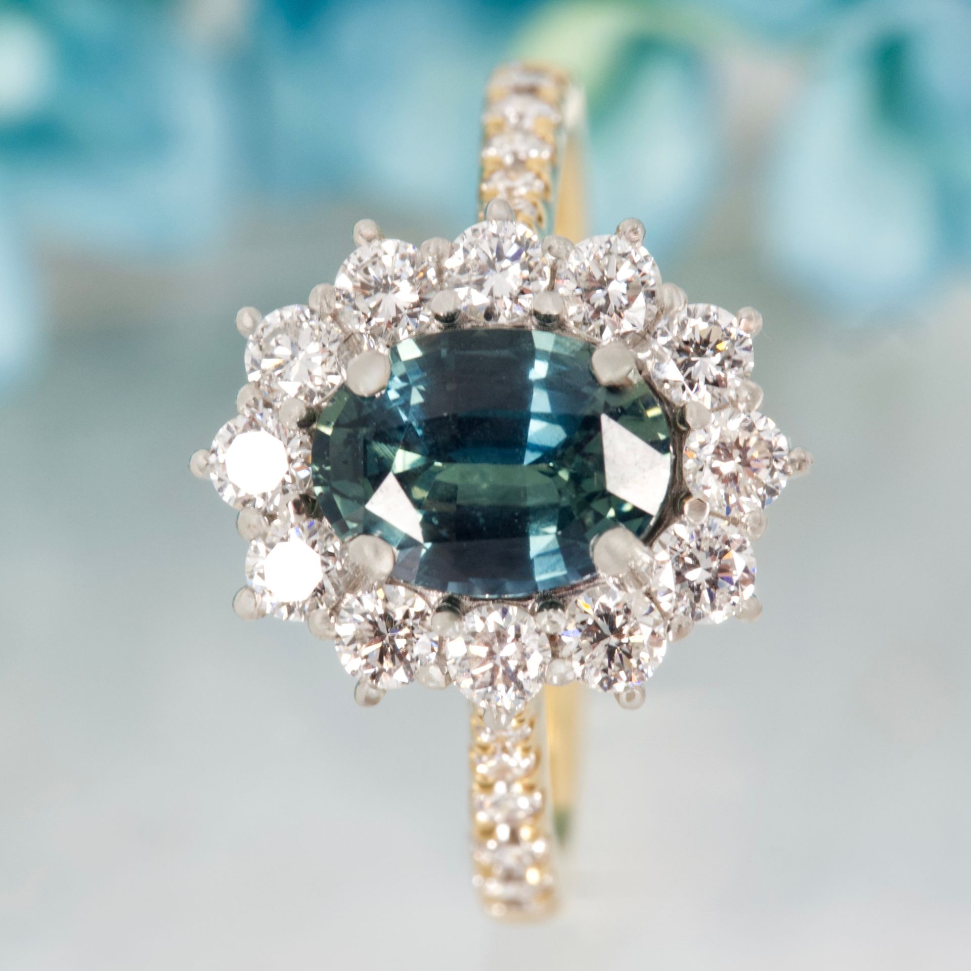 18ct Yellow Gold & Platinum Oval Cut Teal Sapphire & Round Brilliant Cut Diamond Cluster Ring