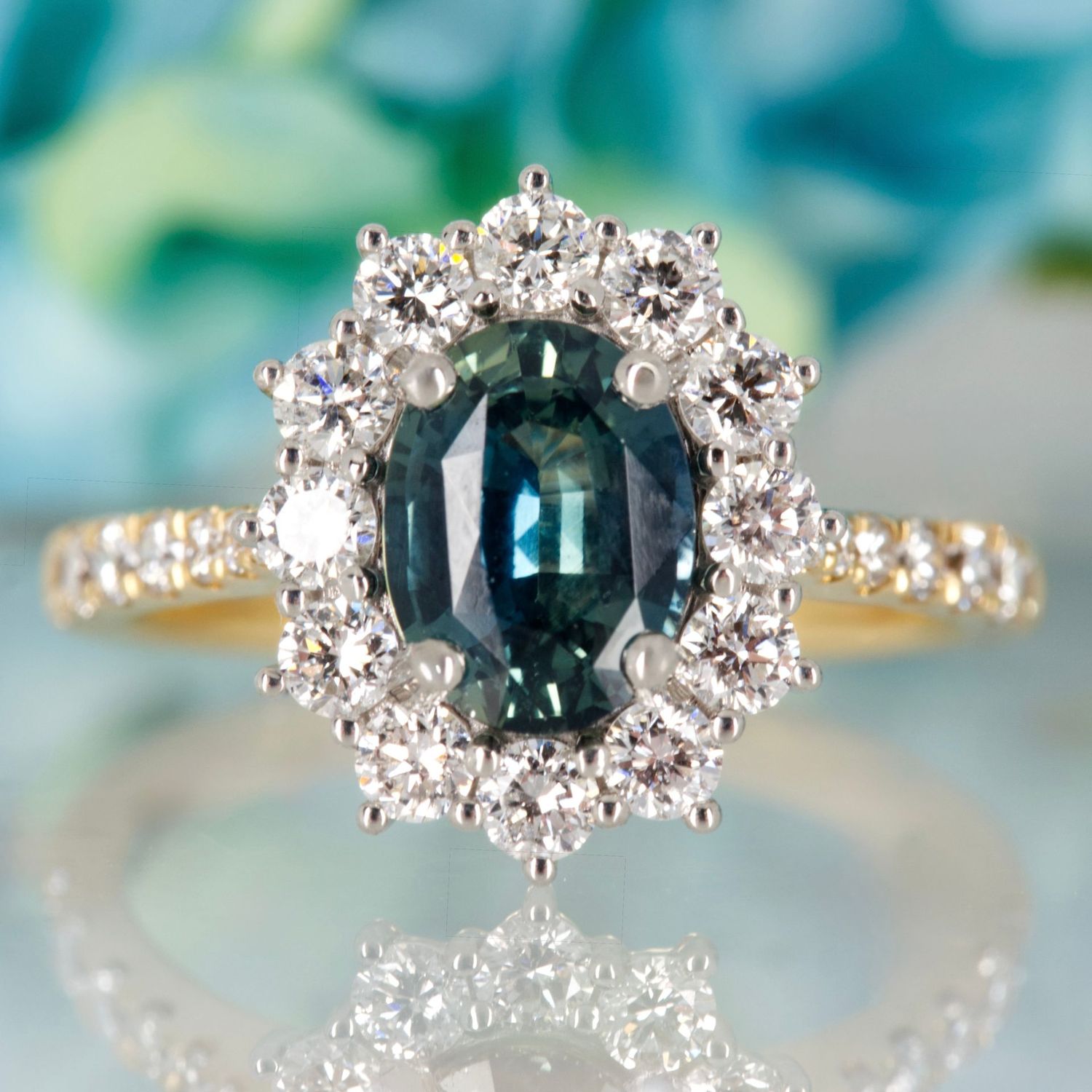 18ct Yellow Gold & Platinum Oval Cut Teal Sapphire & Round Brilliant Cut Diamond Cluster Ring