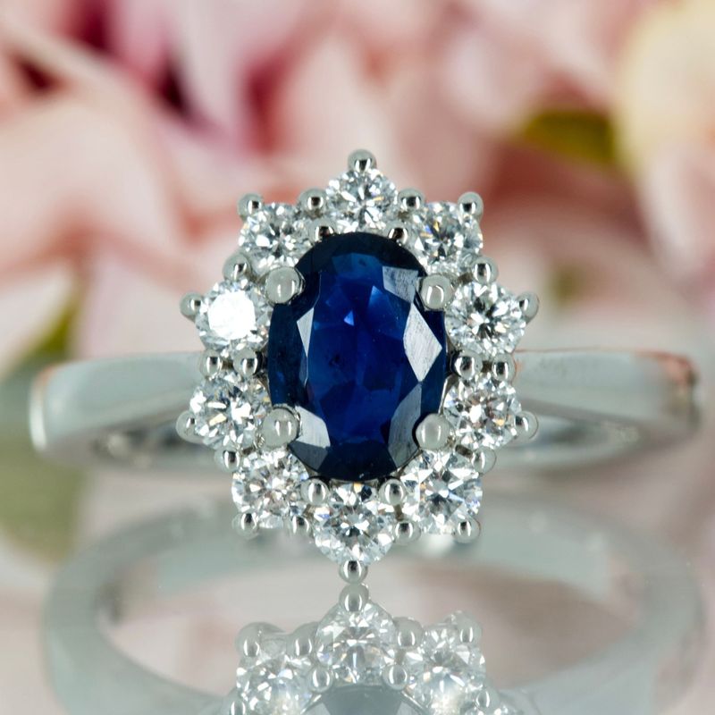 Platinum Oval Cut Sapphire & Round Brilliant Cut Diamond Cluster Ring