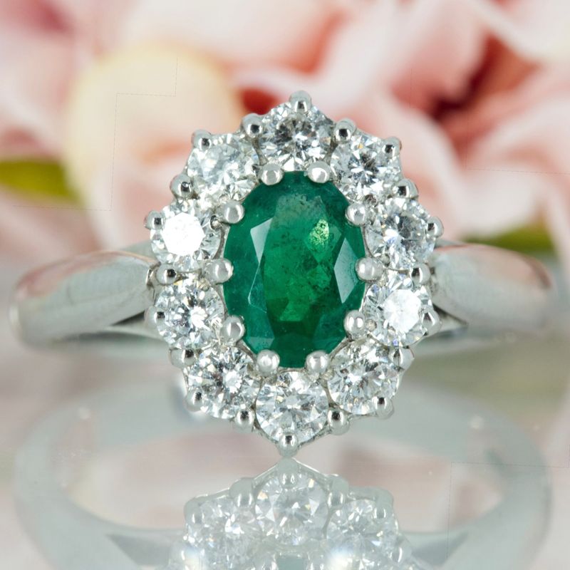 Platinum Oval Cut Emerald & Round Brilliant Cut Diamond Cluster Ring