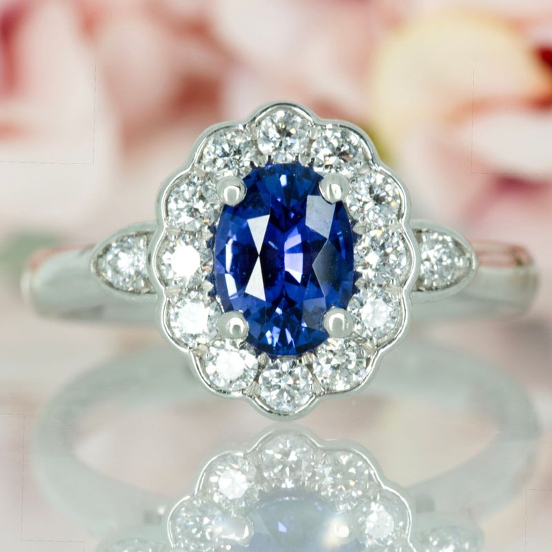 Platinum Oval Cut Sapphire & Round Brilliant Cut Diamond Cluster Ring