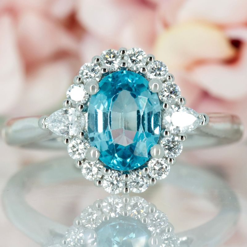 Platinum Oval Cut Blue Zircon & Pear and Round Brilliant Cut Diamond Cluster Ring
