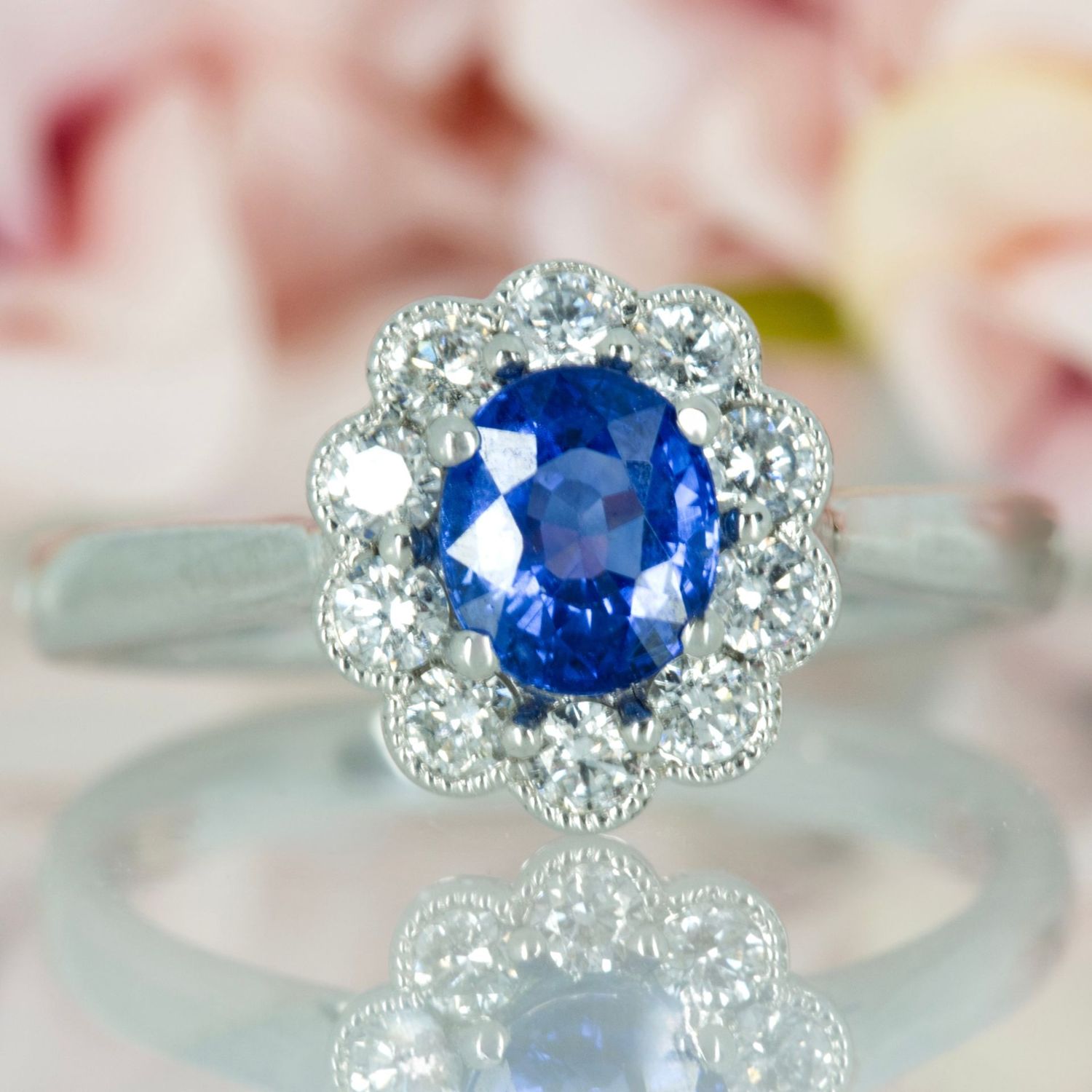 Platinum Oval Cut Sapphire & Round Brilliant Cut Diamond Cluster Ring