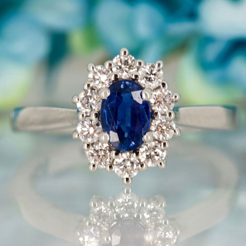Platinum Oval Cut Sapphire & Round Brilliant Cut Diamond Cluster Ring