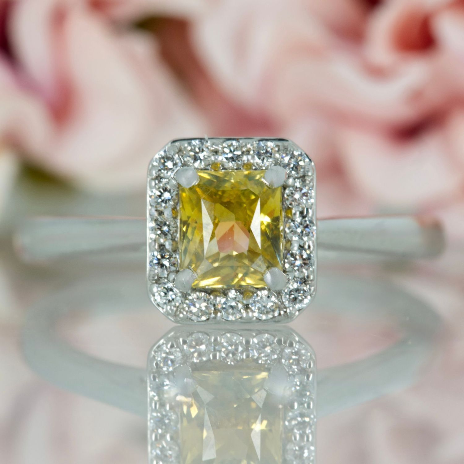 Platinum Radiant Cut Yellow Sapphire & Round Brilliant Cut Diamond Halo Cluster Ring Platinum Radiant Cut Yellow Sapphire & Round Brilliant Cut Diamond Halo Cluster Ring