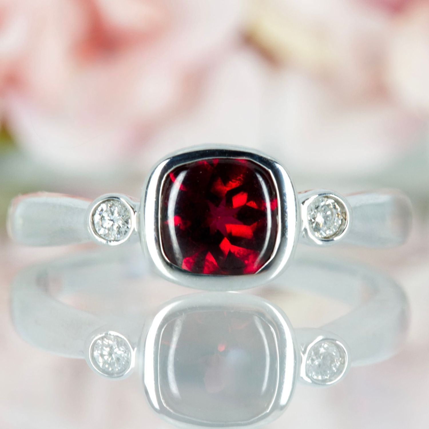 Pre-Loved 18ct White Gold Cushion Cut Garnet & Round Brilliant Cut Diamond Trilogy Ring