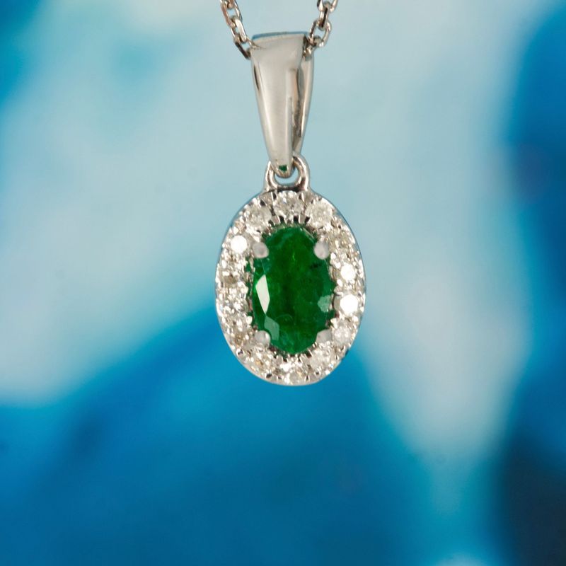9ct White Gold Oval Cut Emerald & Round Brilliant Cut Diamond Halo Cluster Pendant & Chain