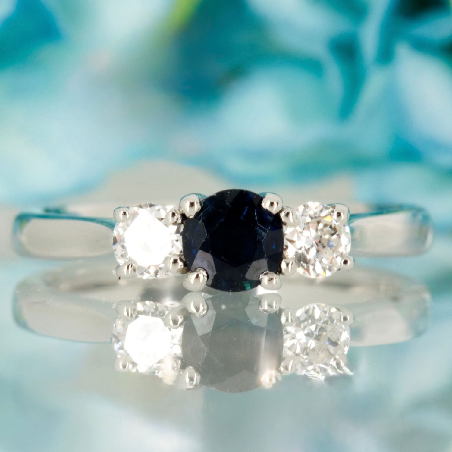 Pre-Loved Platinum Round Cut Sapphire & Round Brilliant Cut Diamond Trilogy Ring