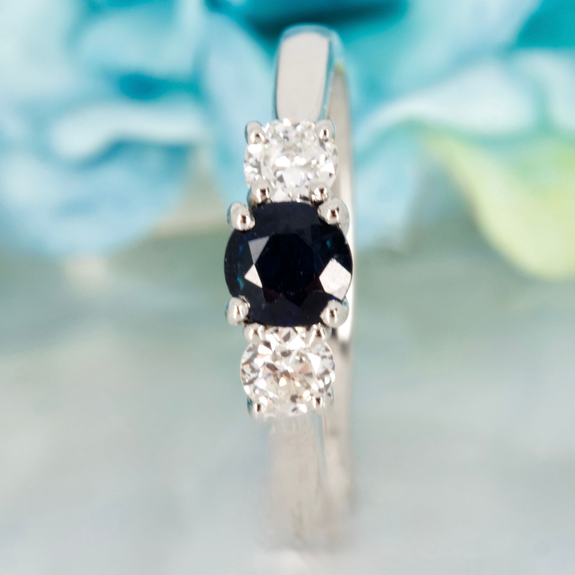 Pre-Loved Platinum Round Cut Sapphire & Round Brilliant Cut Diamond Trilogy Ring