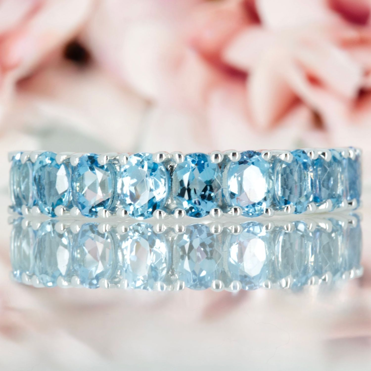 9ct White Gold Oval Cut Aquamarine Nine Stone Half Eternity Ring