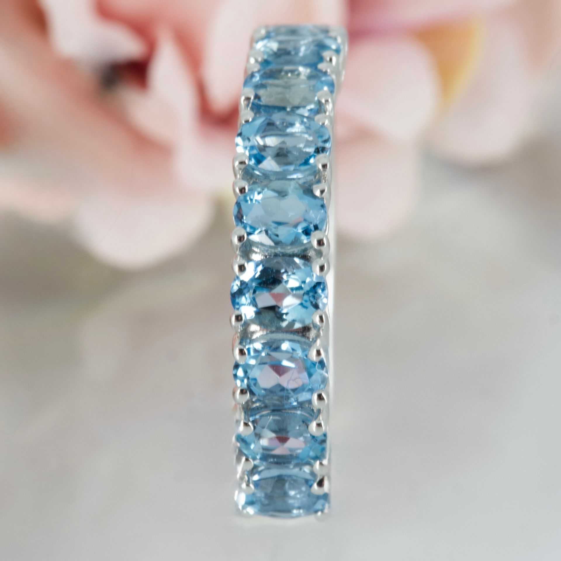 9ct White Gold Oval Cut Aquamarine Nine Stone Half Eternity Ring