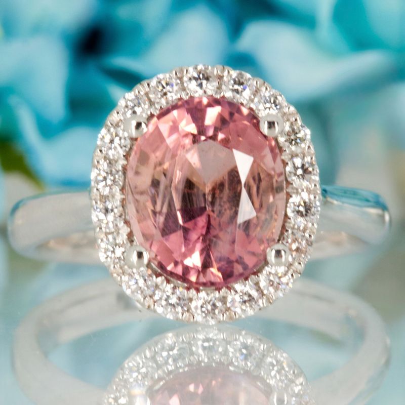 Platinum Oval Cut Pink Tourmaline & Round Brilliant Cut Diamond Halo Cluster Ring